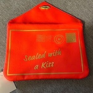 Ipsy red faux leather sealed with a kiss letter clutch